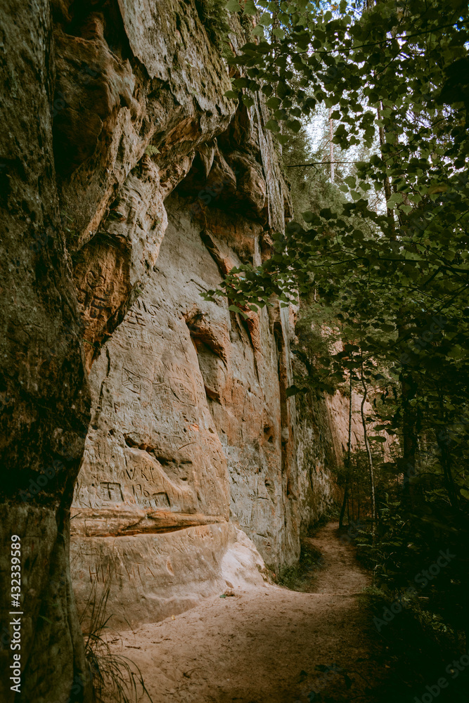 Hiking trail by the Licu and Langu sandstone cliffs by the Gauja river in Latvia Hiking trail by the Licu and Langu sandstone cliffs by the Gauja river in Latvia