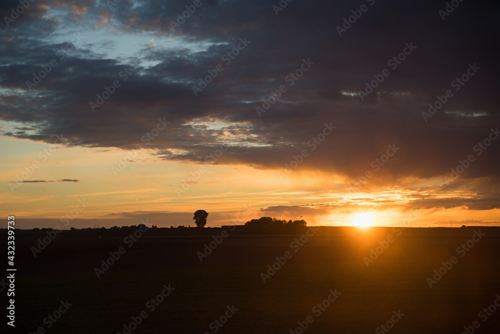 rural sunset landscape, fields and clouds