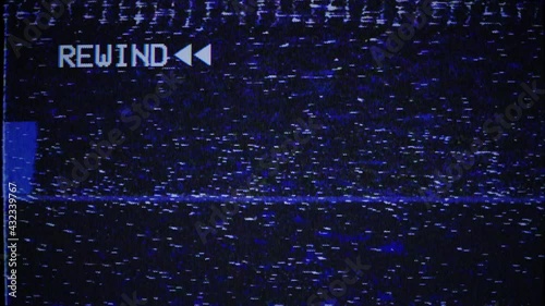 Rewind sign, arrows marks, VHS noise texture. Static noise, glitch effect. Videocassette recorder. Damaged cassette  type, bad signal. TV noise. Retro, vintage 90s style animation. Seamless loop 4K  photo