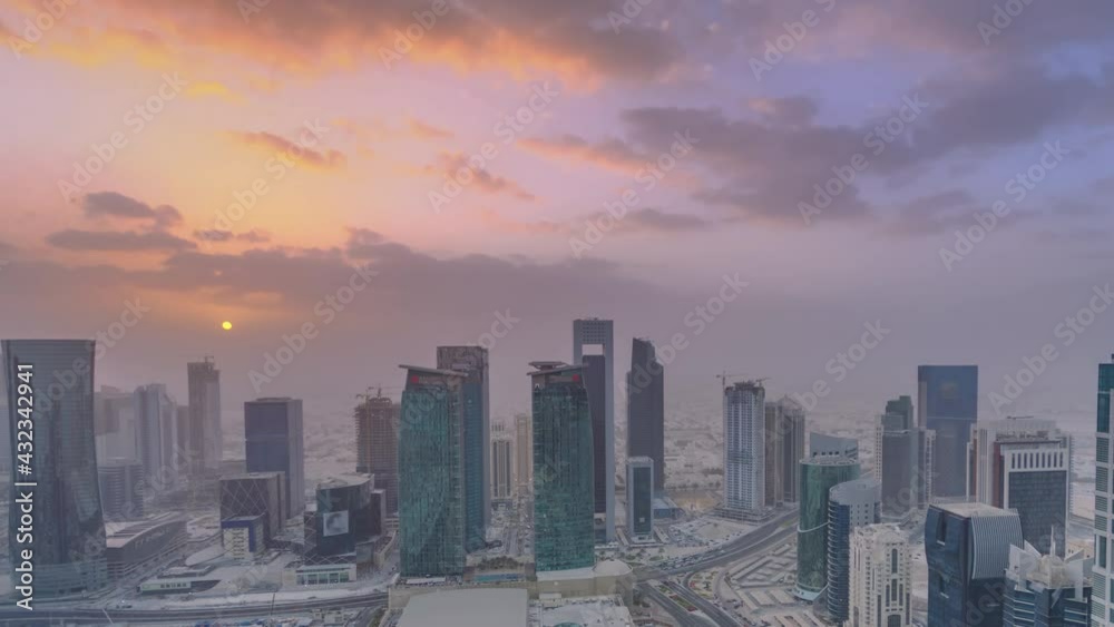 Skyscrapers at sunset timelapse in the skyline of commercial center of Doha, the capital Qatar Skyscrapers at sunset timelapse in the skyline of commercial center of Doha, the capital Qatar
