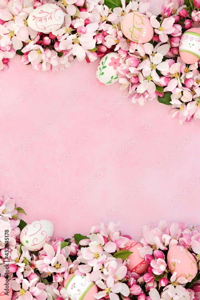 Easter egg & apple blossom flower border on mottled pink. Greetings card, invitation or gift tag for Easter. Flat lay. 