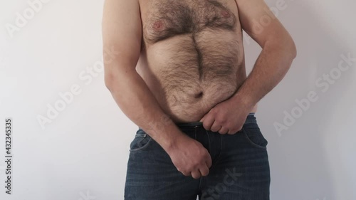 Fat Man -Fat man body trying to put on his tight jeans