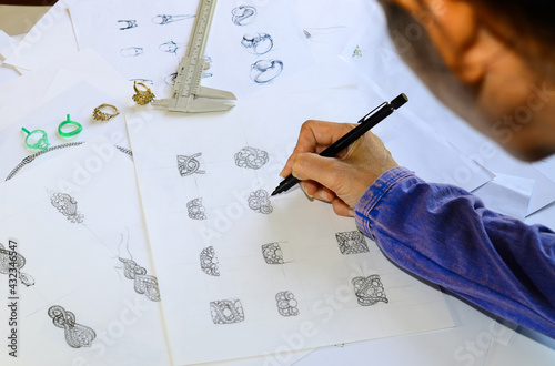 The sketch is designing jewelry rings.