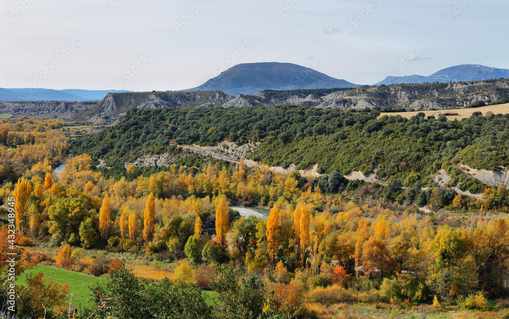 Rock formations and autumn forest from Binies village, Spain