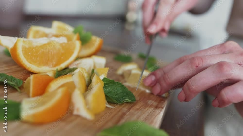 Young woman preparing a healthy breakfast with fruits.Healthy food concept and vegetarianism Young woman preparing a healthy breakfast with fruits.Healthy food concept and vegetarianism