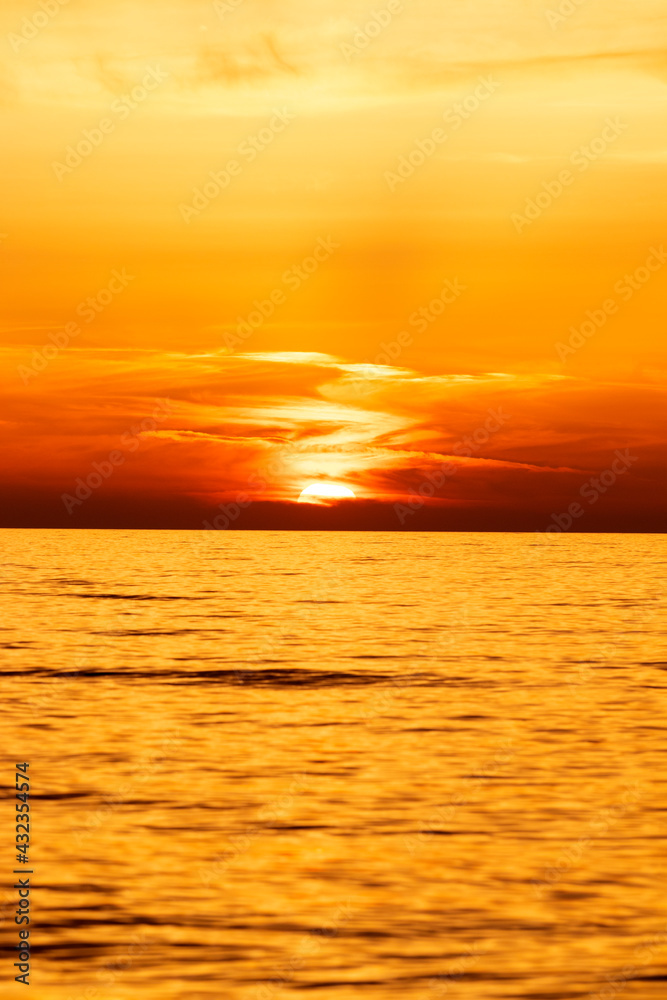Beautiful Orange Sunset with Big Sun over the Sea Horizon, Nature Background