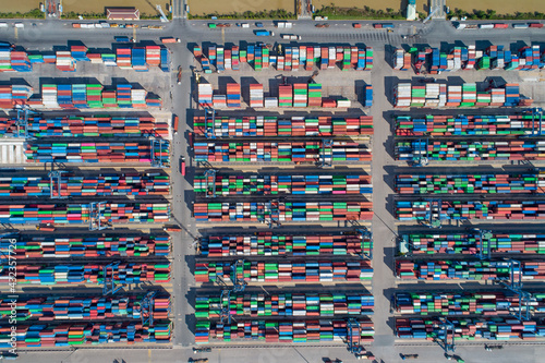 Container ship working, Business import export logistic and transportation of International by container ship in the open sea, Aerial view industrial crane loading cargo freight port, Vietnam