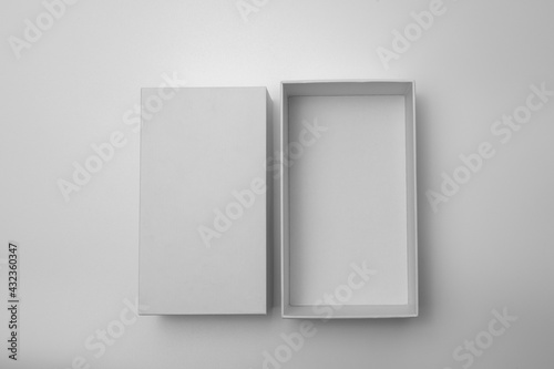 Blank open rectangular box with box separate lid isolated on background