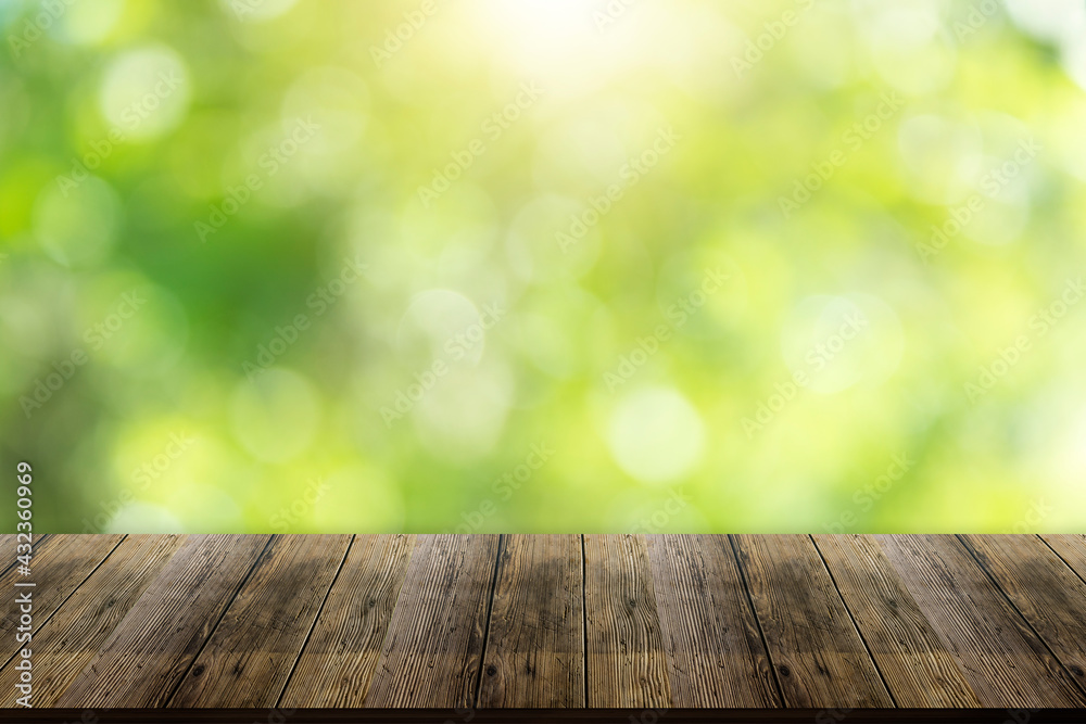 Beautiful wood floor and natural green bokeh background. Beautiful wood floor and natural green bokeh background.