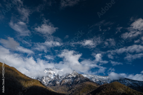 Snow on the mountains with blue sky photo