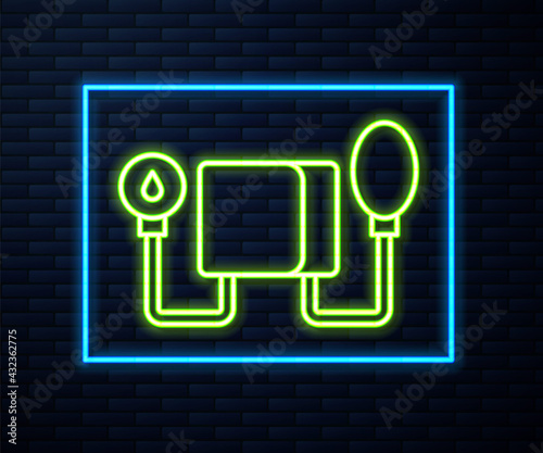 Glowing neon line Blood pressure icon isolated on brick wall background. Vector