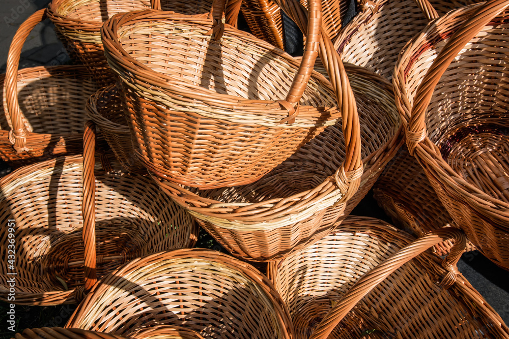 Hand-woven baskets of willow vines in yellow-gold tones