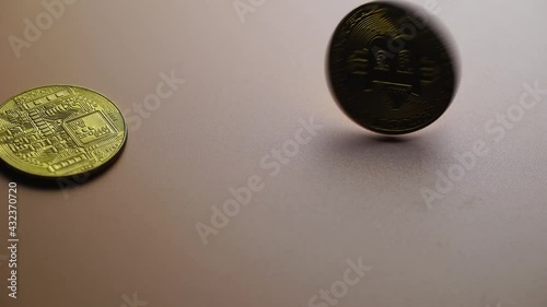 spinning bitcoin on wooden table top