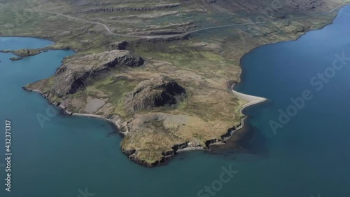 Holmanes peninsula with blue water of Reyðarfjörður fjord in Iceland, aerial photo