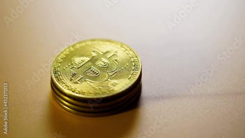 close up of hand stacking the bitcoins