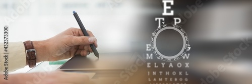Snellen chart over a woman using graphics tablet, technology and corporate concepts