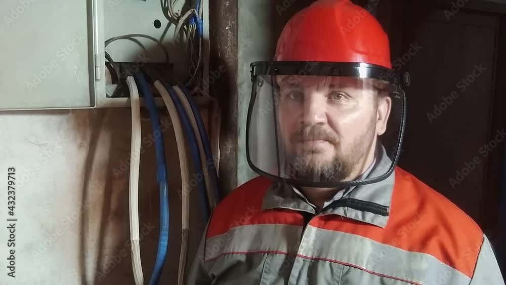 The worker covers his face with a protective mask. The worker covers his face with a protective mask.