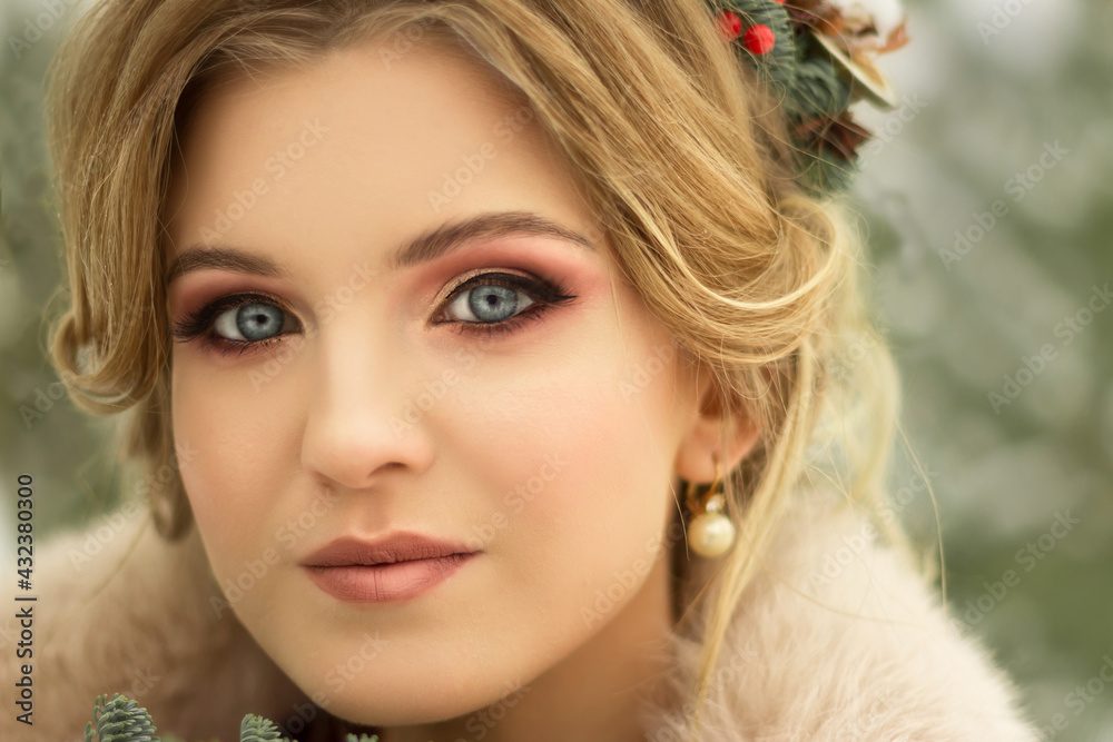 beautiful girl with flowers in her hair in winter, bride, portrait