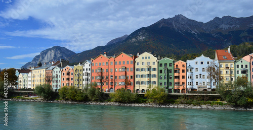 The Inn River, Colourful riverside buildings and Nordkette Mountain Range, Innsbruck, Austria © Paula