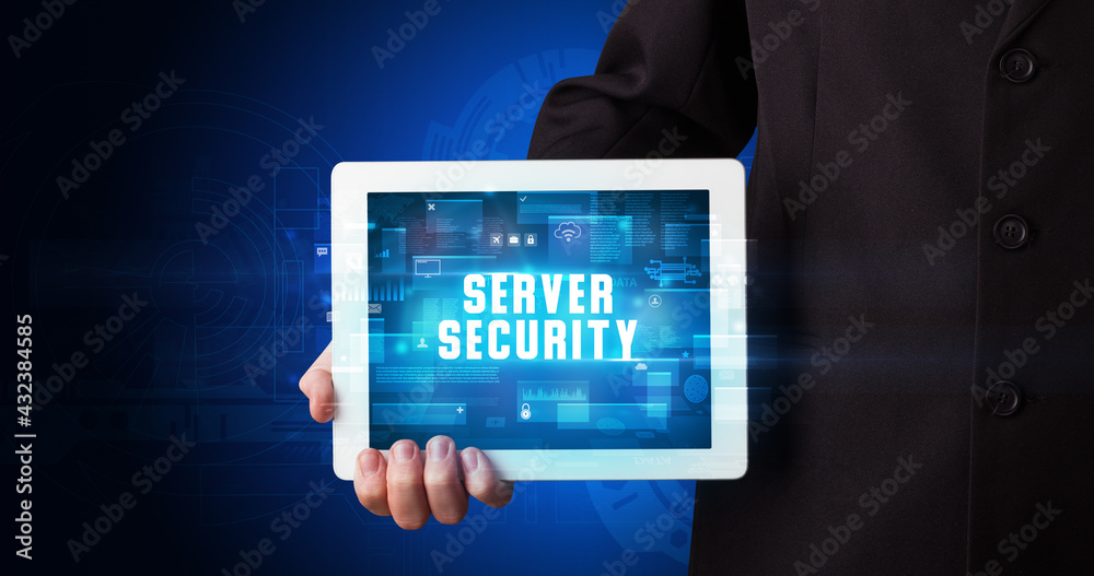 Person holding tablet, security concept Person holding tablet, security concept
