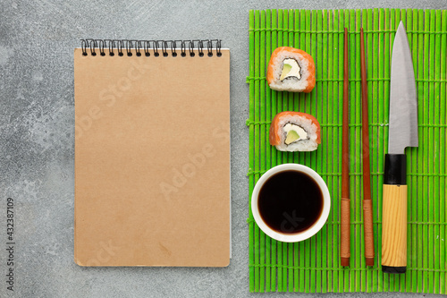 Sushi set sashimi and sushi rolls served on stone slate