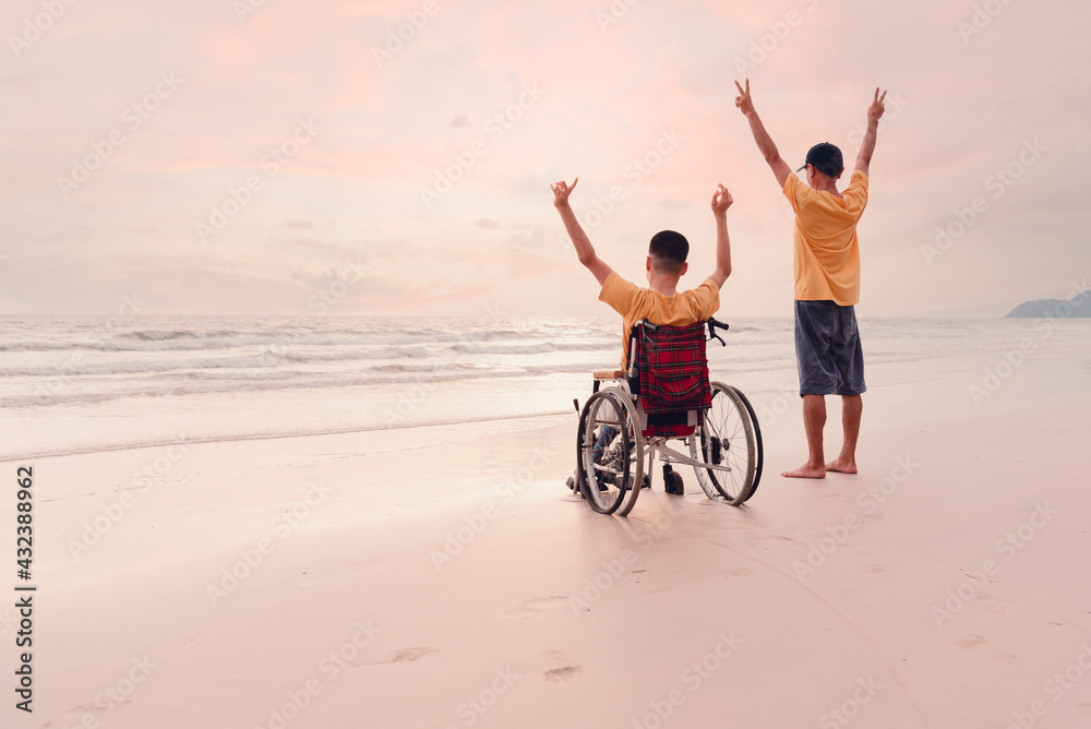 Asian special child on wheelchair on the beach with parents in family ...