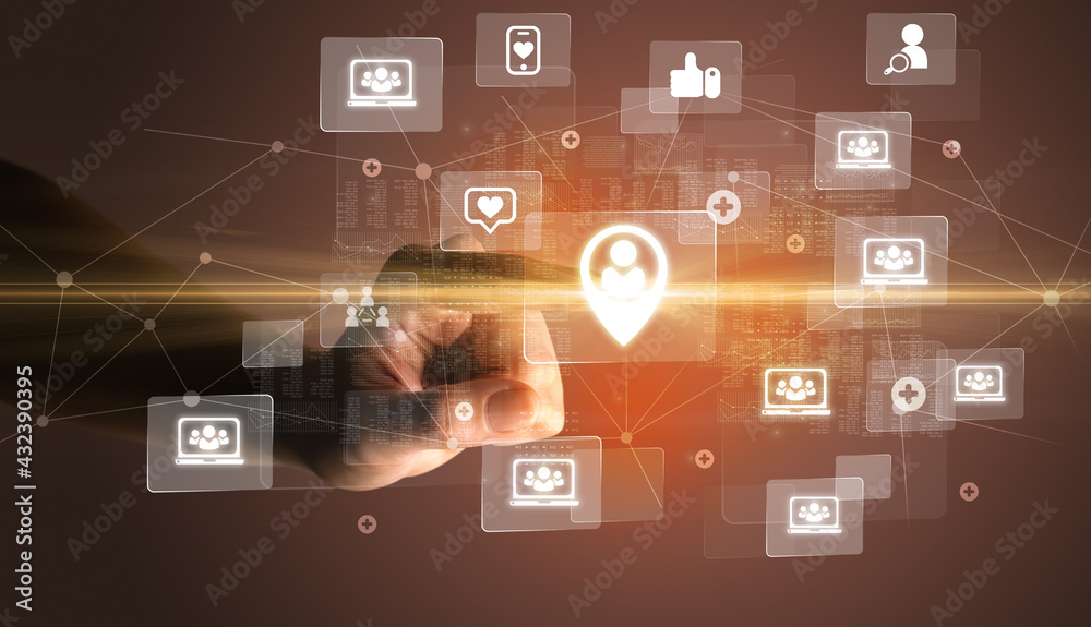 Hand pressing social media multimedia application screen with media icons on futuristic concept Hand pressing social media multimedia application screen with media icons on futuristic concept