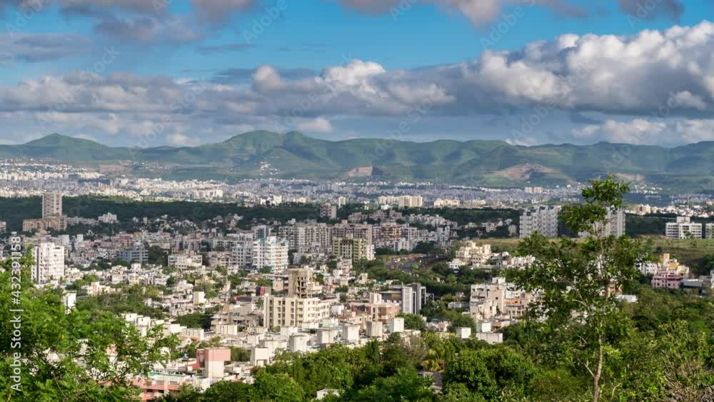 Cityscape View and Time Lapse of Clouds Passing over and Casting Shadows over the City of Pune, Maharashtra, India Cityscape View and Time Lapse of Clouds Passing over and Casting Shadows over the City of Pune, Maharashtra, India