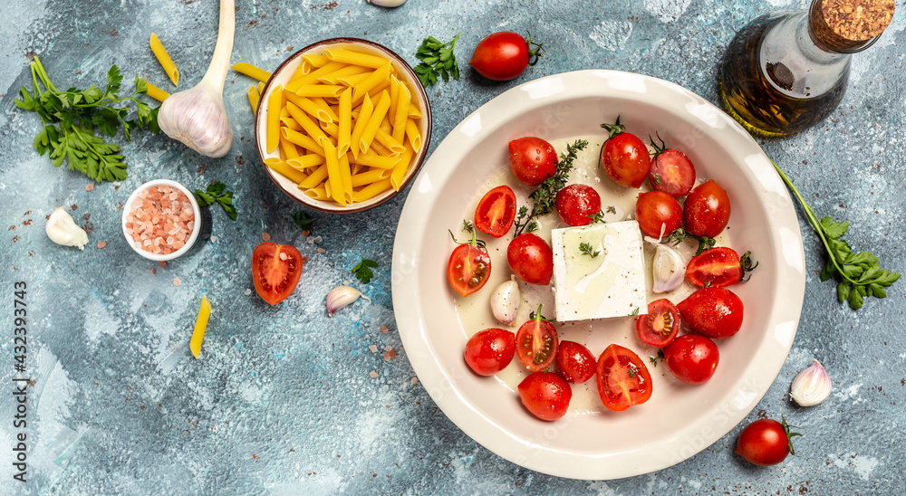 Trending fetapasta hot salad with baked tomatoes and feta. Preparation of ingredients for feta pasta. banner, menu recipe place for text, top view Trending fetapasta hot salad with baked tomatoes and feta. Preparation of ingredients for feta pasta. banner, menu recipe place for text, top view
