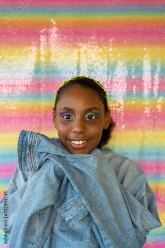 Young black girl with oversized denim jacket