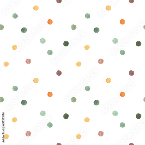 Hand drawn watercolor seamless polka dot pattern with small circles in warm yellow and green colors.