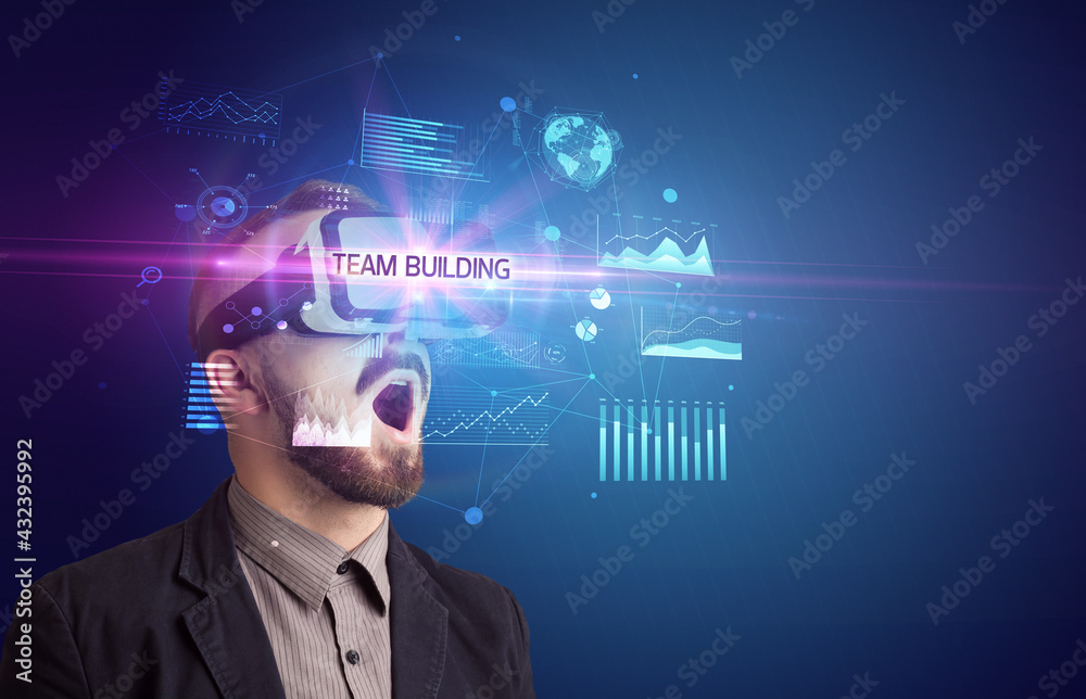Businessman looking through Virtual Reality glasses