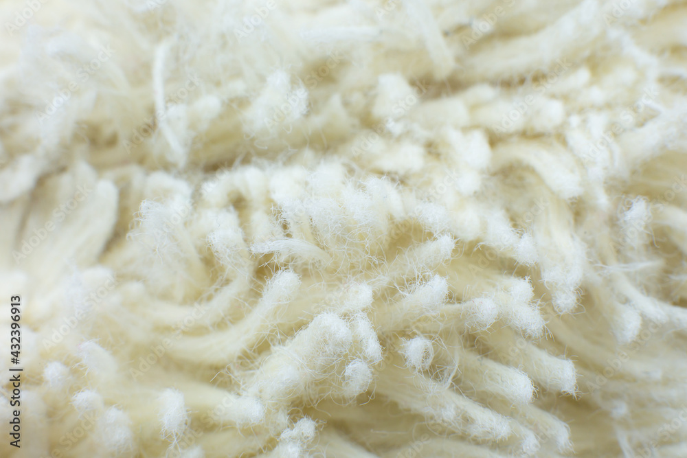 White cotton towel or carpet.fluffy texture background. Close up, macro photo. Soft focus image.