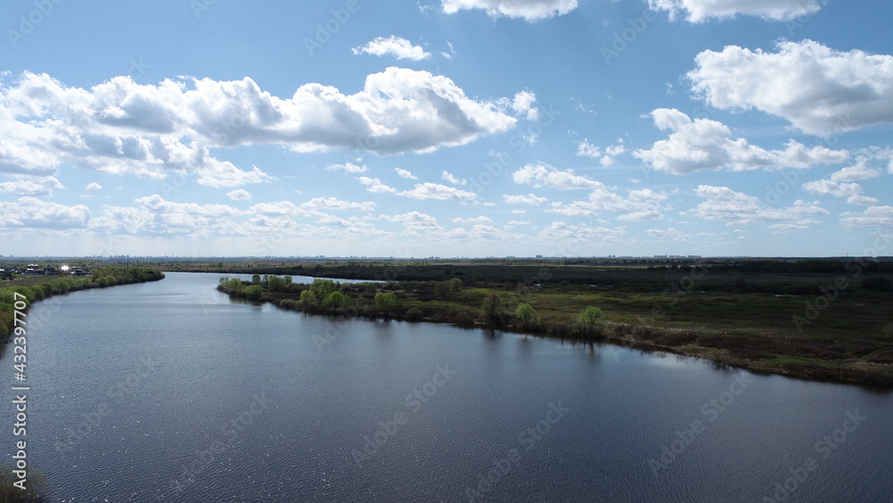 View of the Staritsa river and the city of Ryazan on the horizon on a sunny spring day