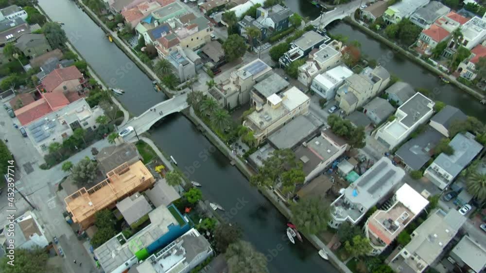 Aerial Shot Of Cars Amidst Houses At Venice Canals In City, Drone Flying Forward Over Residential District - Los Angeles, California Aerial Shot Of Cars Amidst Houses At Venice Canals In City, Drone Flying Forward Over Residential District - Los Angeles, California