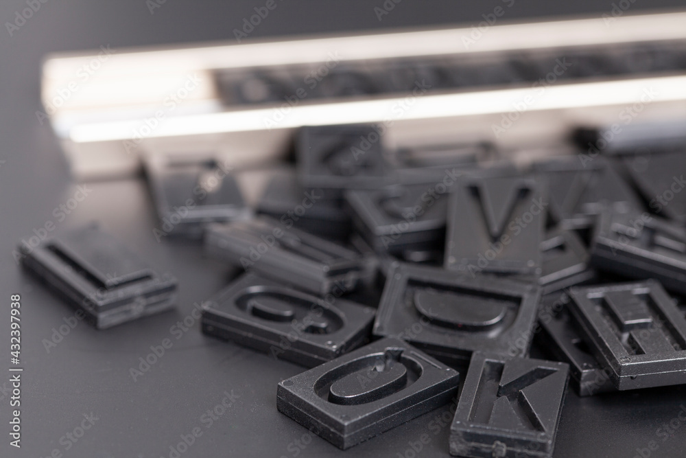 letterpress alphabet and numbers on black background letterpress alphabet and numbers on black background