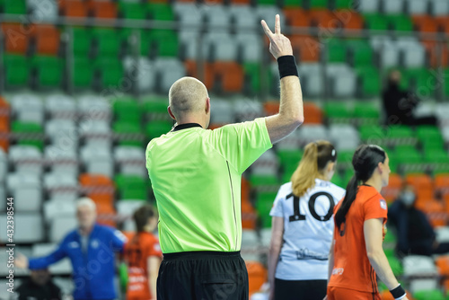 Referee shows two minutes of punishment during women handball match