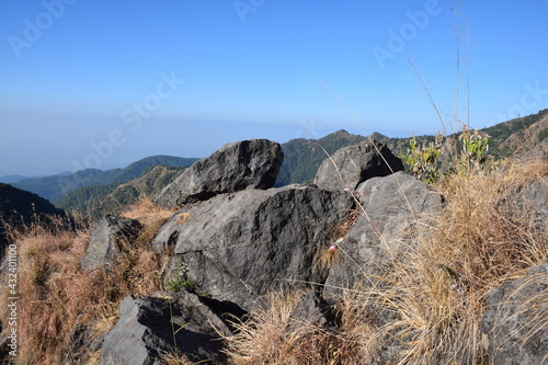 Big rocks on mountain. blue sky in background. Selective Focus On Subject, Background Blur