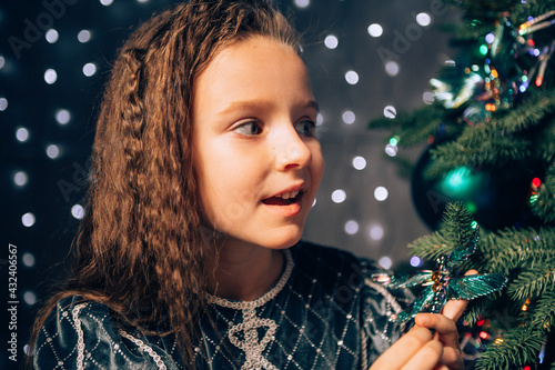 little girl with christmas tree