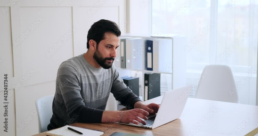 Businessman working on laptop and analyzing document at office Businessman working on laptop and analyzing document at office