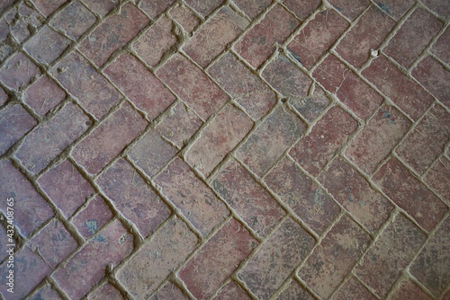 Texture and background of old brown brick paving slabs. Top view