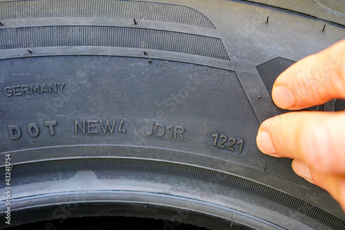 Side view of tire with designation of week and year of tire production photo