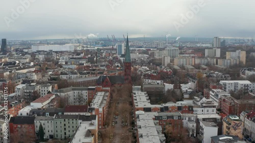 Aerial view of St Peters church in Hamburg surrounded by urban apartment buildings photo