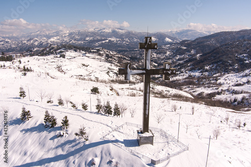 Gonio, Georgia - March 15, 2021: aerial footage of the Orthodox cross on the mountain photo