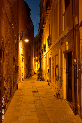 The one of many deserted narrow cozy streets in Cagliari, Sardinia, Italy.