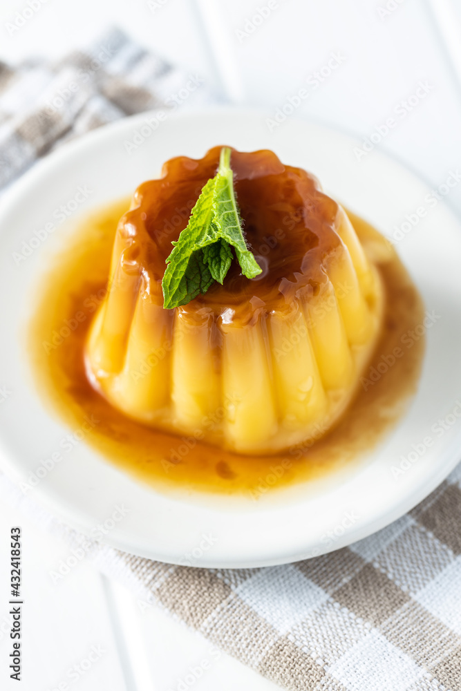 Sweet vanilla pudding. Sweet dessert with caramel topping. Sweet vanilla pudding. Sweet dessert with caramel topping.
