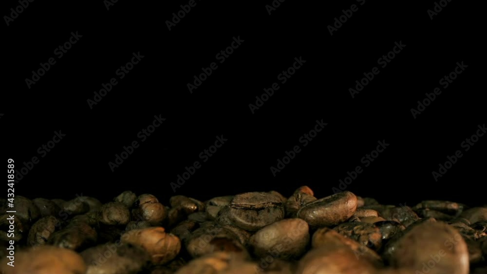 Close up of seeds of coffee. Fragrant coffee beans. Slow Motion Macro shot. Close up of seeds of coffee. Fragrant coffee beans. Slow Motion Macro shot.