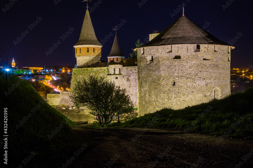 View on the Kamianets-Podilskyi castle in the night. Beautiful s
