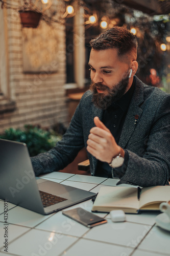 Businessman using a laptop in a cafe