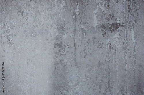 The texture of the old stucco wall with scratches, cracks, dust, crevices, roughness. Can be used as a poster or background for design. © INTHEBLVCK